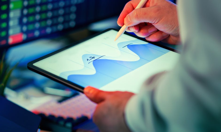 Analyst reviewing performance data on tablet
