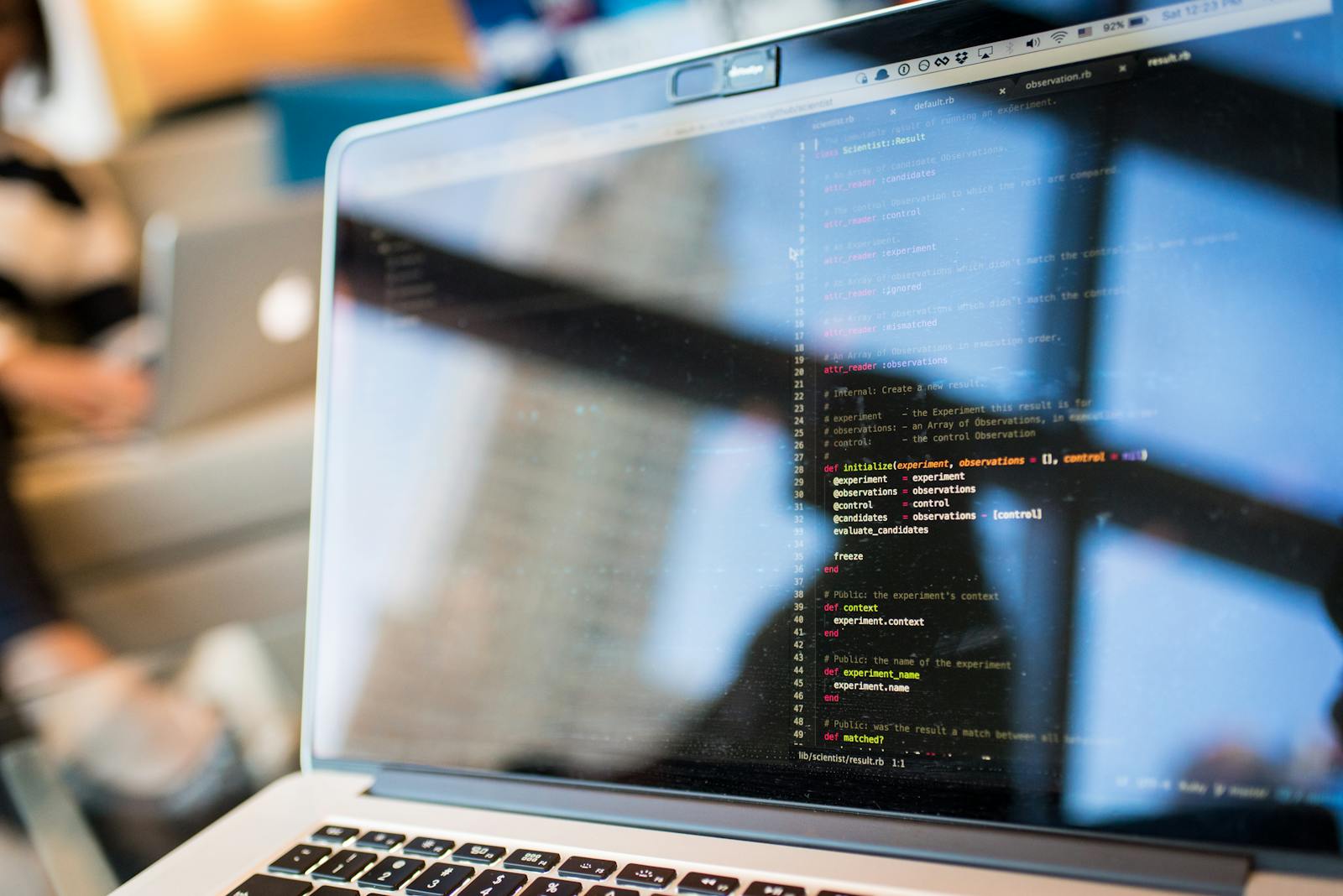 ML engineer coding model training pipeline on laptop