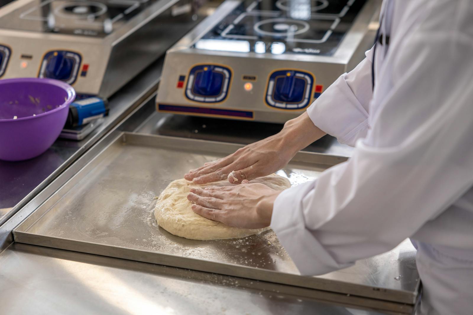 Chef managing digital orders in kitchen